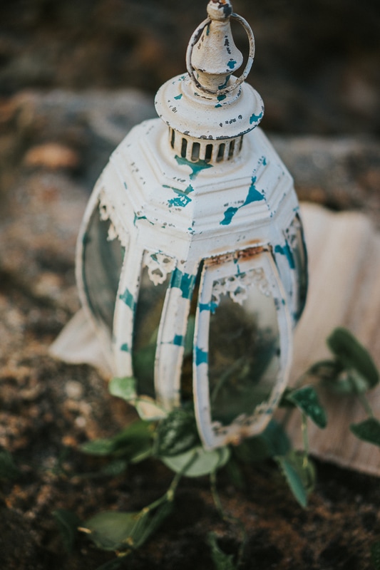 Coral Cove beach elopement antique white and blue lantern close-up
