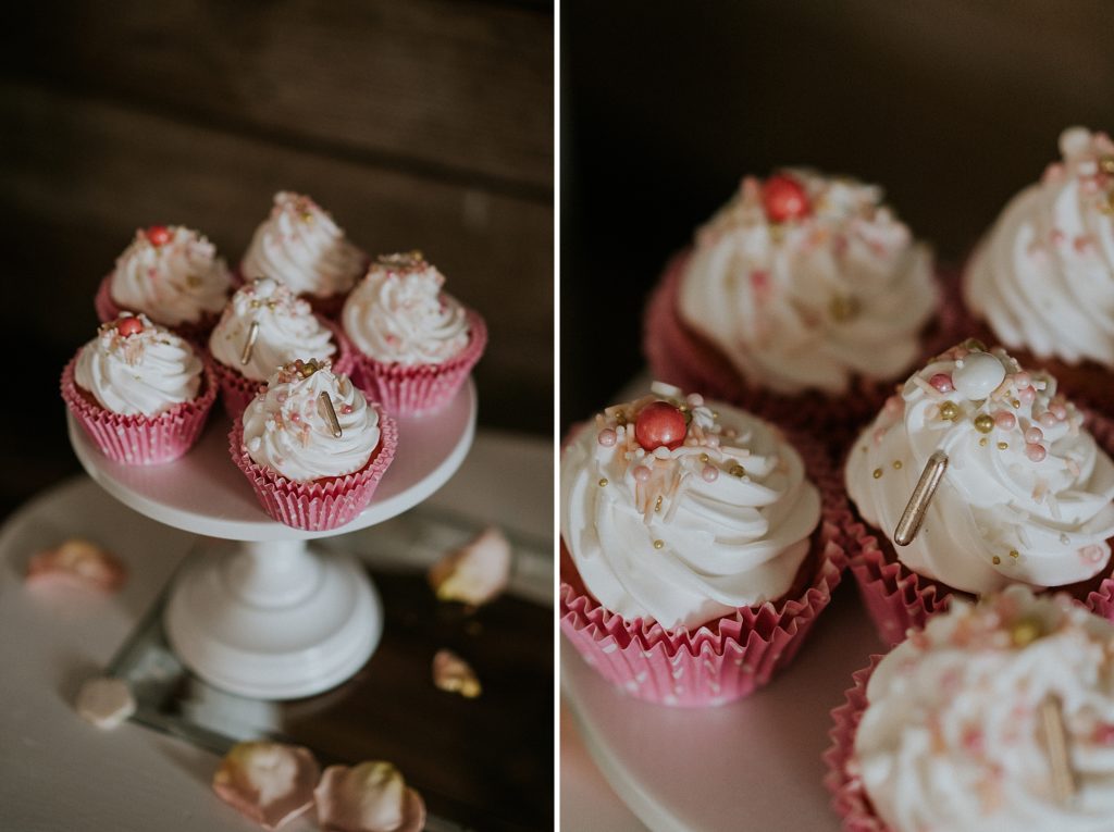 Pink Lemonade themed wedding cupcakes with white icing, metallic and pink sprinkles, and pink cupcake wrappers at Twisted Oak Farm Vero Beach FL barn wedding
