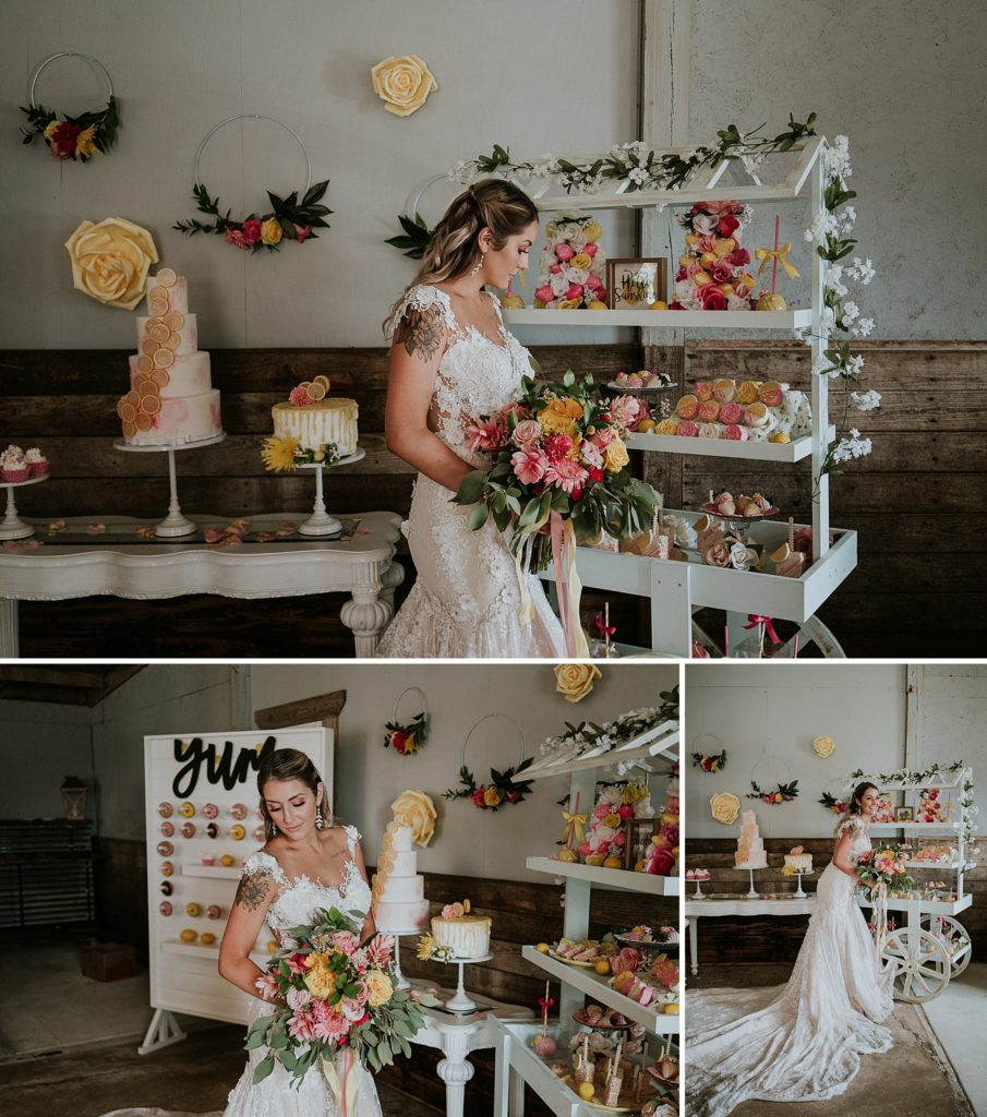 Bride posing in front of wedding cake, dessert buffet cart, and donut wall for Pink Lemonade photoshoot barn wedding at Twisted Oak Farm in Vero Beach FL