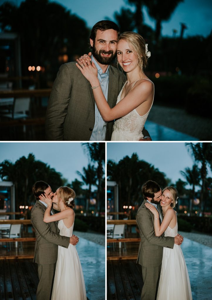 Wedding couple kiss outside on their rainy wedding day at dusk