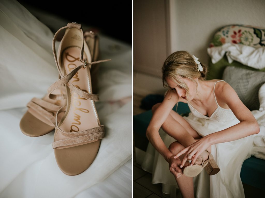Close-up of nude strappy heels next to the bride putting her shoes on