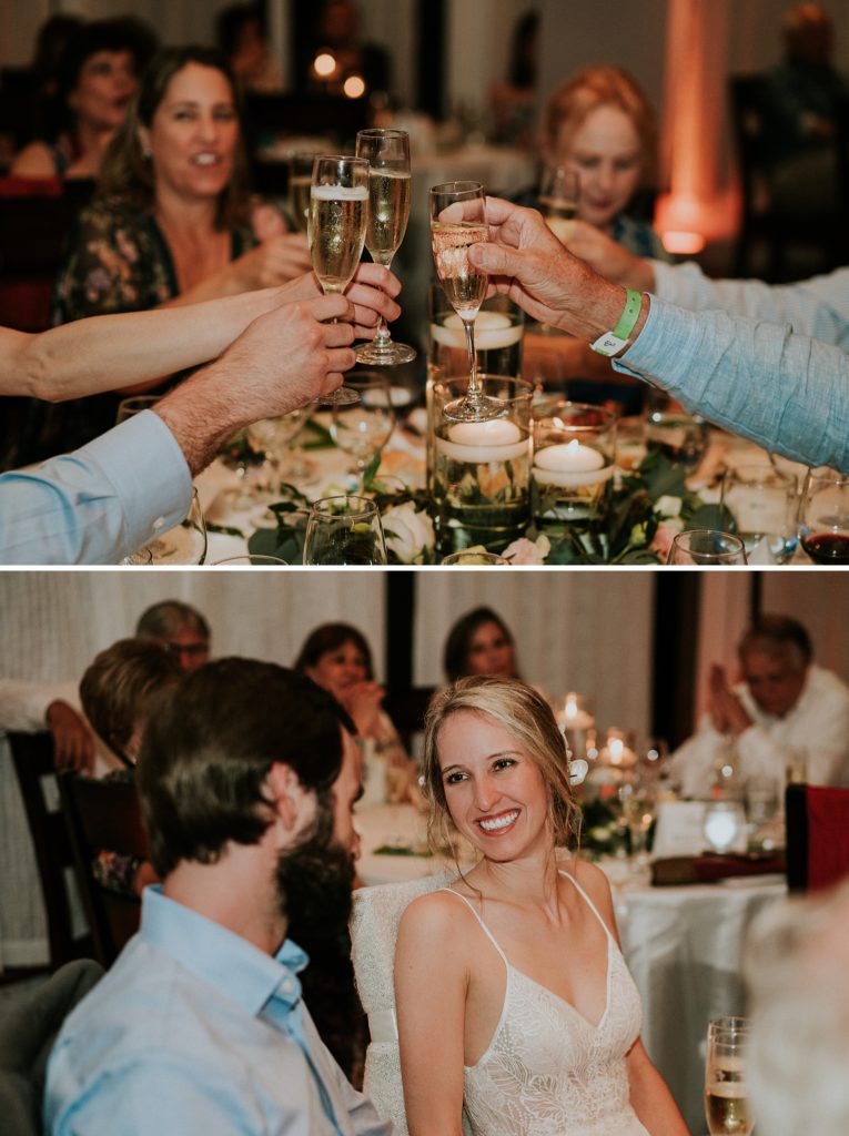 Close-up of wedding guests toasting their champagne glasses while bride looks at groom
