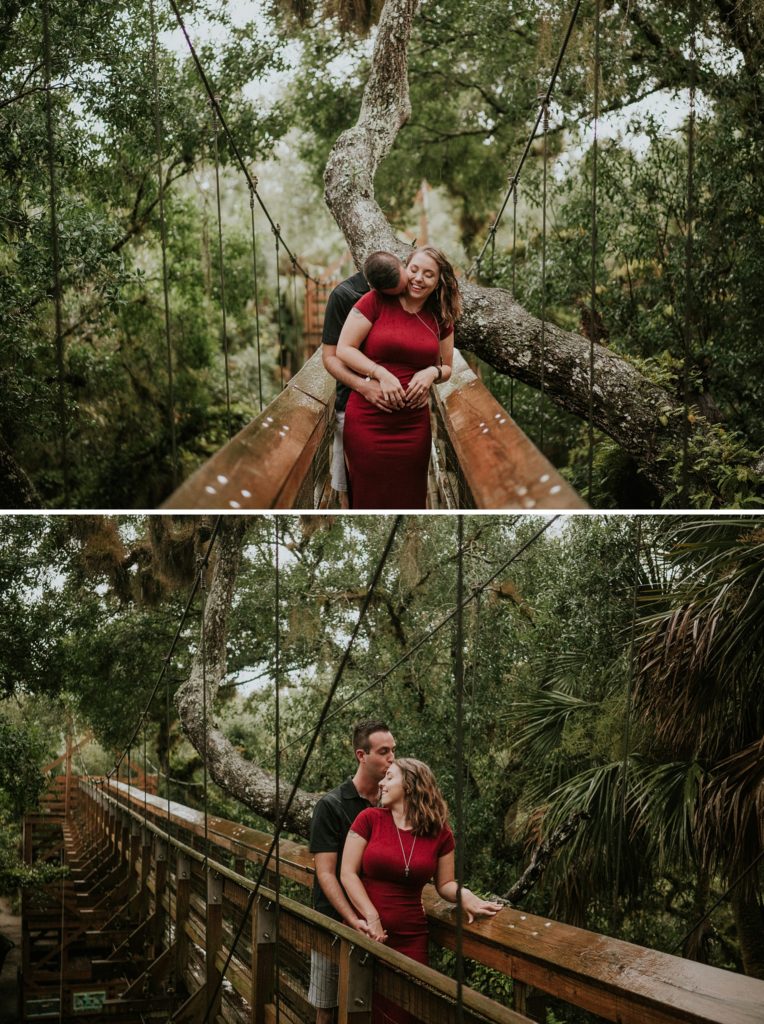 Engaged couple embraces on suspended bridge on Myakka Canopy Walkway before Sarasota wedding