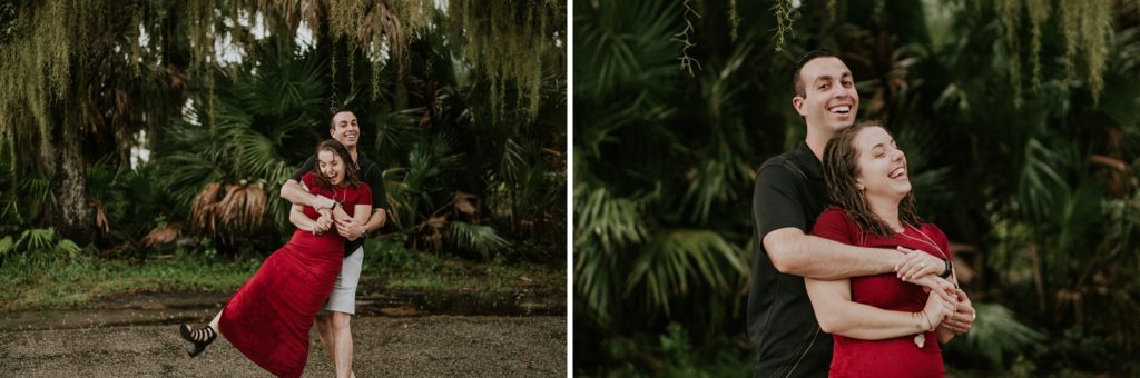 Couple dancing, hugging, and laughing in the rain for engagement photos at Myakka River state park