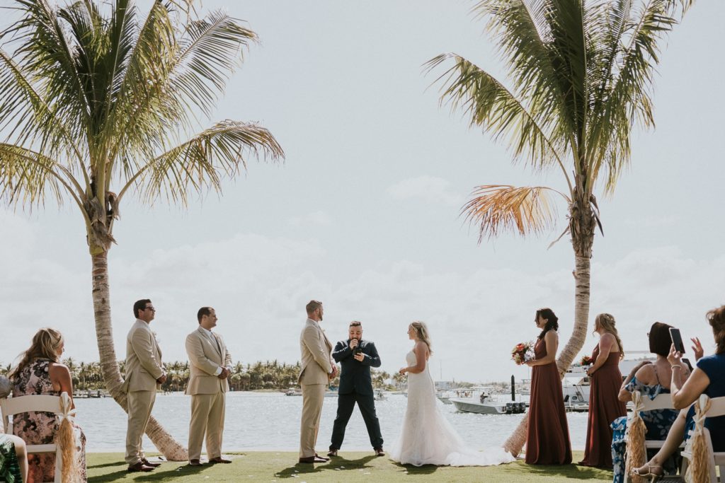 Sailfish Marina Singer Island destination wedding ceremony on the water with palm trees