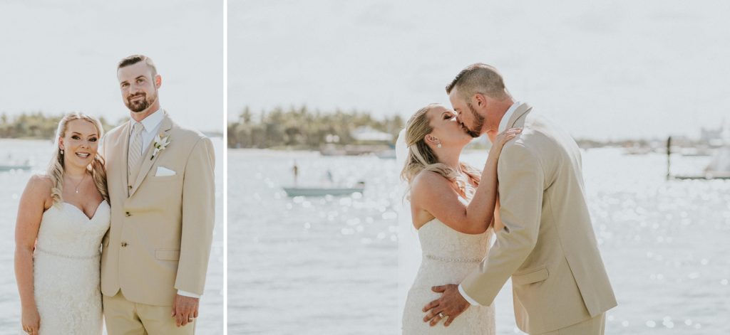 Bride and Groom in khaki suit kissing on water at Sailfish Marina Singer Island Florida wedding
