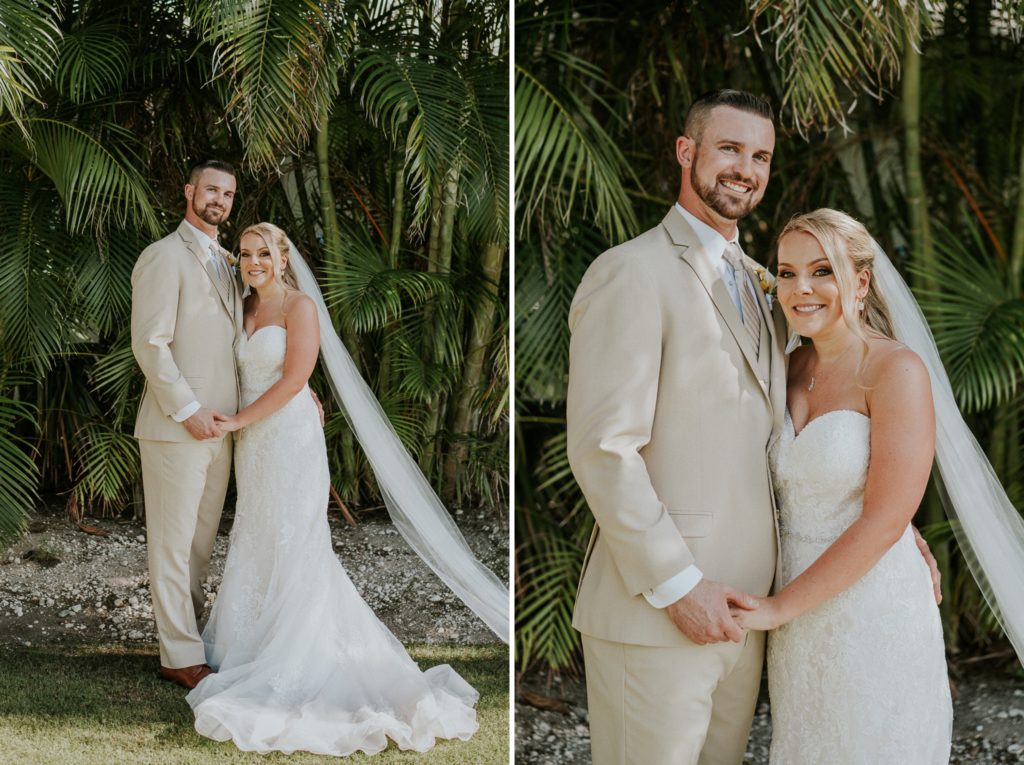 Wedding couple hold hands with long chapel veil in front of green palm fronds and bamboo at Sailfish Marina in Singer Island