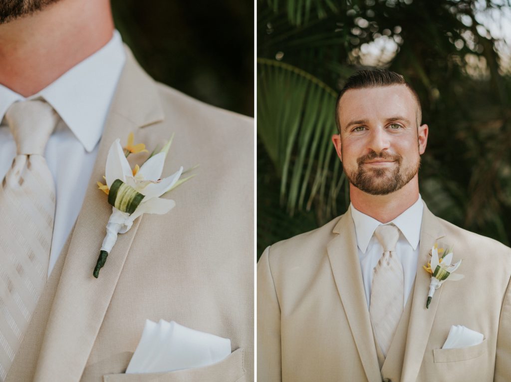 Singer Island wedding groom in khaki suit with tropical boutonnière in front of a green palm frond