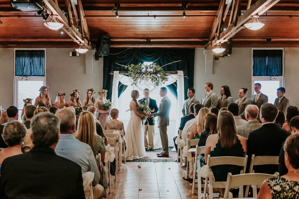 Indoor wedding ceremony with backlit lighting