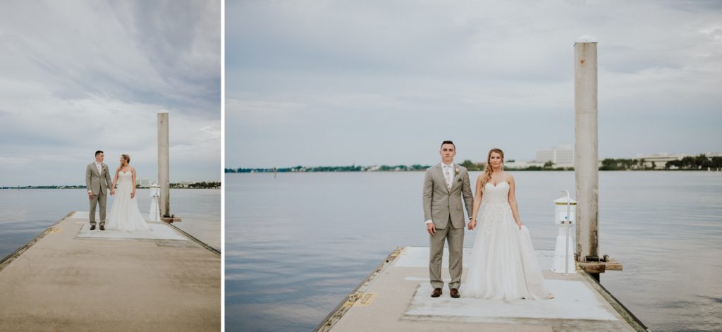 Wes Anderson inspired portrait of FL elopement couple on boat dock on St. Lucie River with cloudy sky