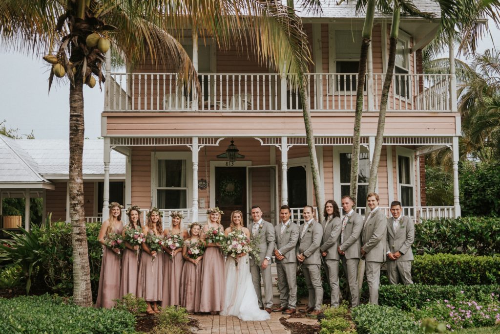 Historic Downtown Stuart Florida wedding party in front of pink house
