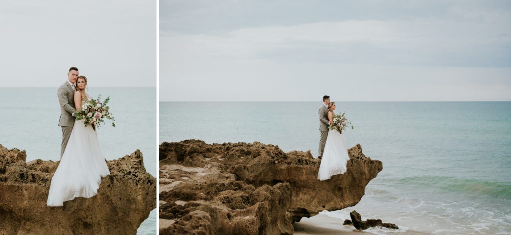 Bride and groom stand on limestone rock above ocean for House of Refuge elopement