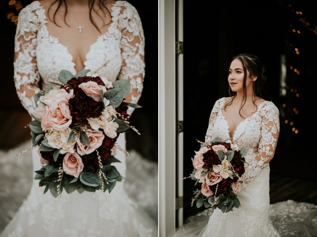 Bride looks away from camera and holds fake flower bouquet with pink and red roses