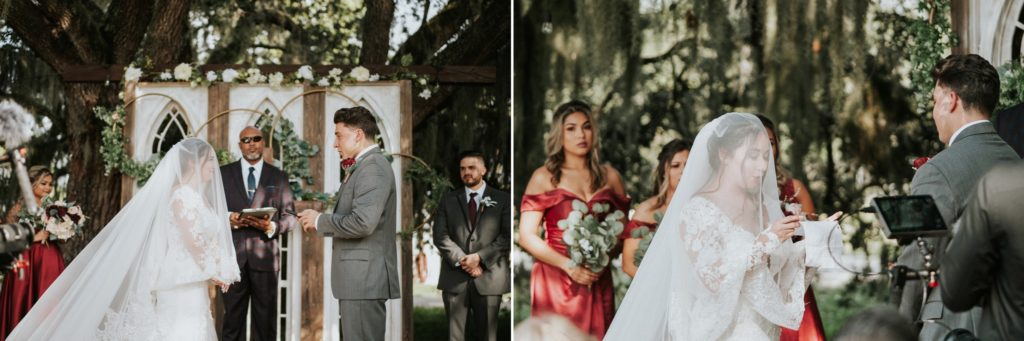 Bride and groom exchange vows during ceremony and bride wears a veil covering her face