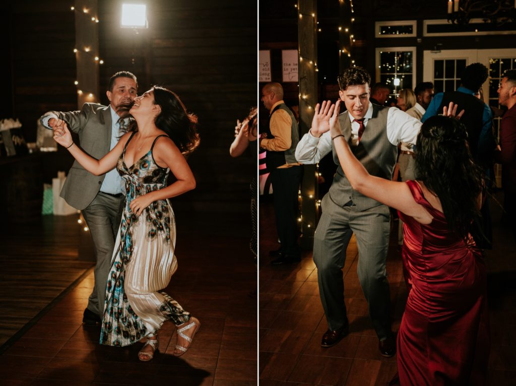 Groom dances with bridesmaid and guests at barn wedding reception