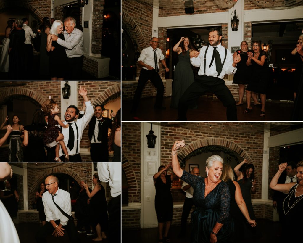 Lively wedding guests dancing in brick reception venue at the Historic Maxwell Room