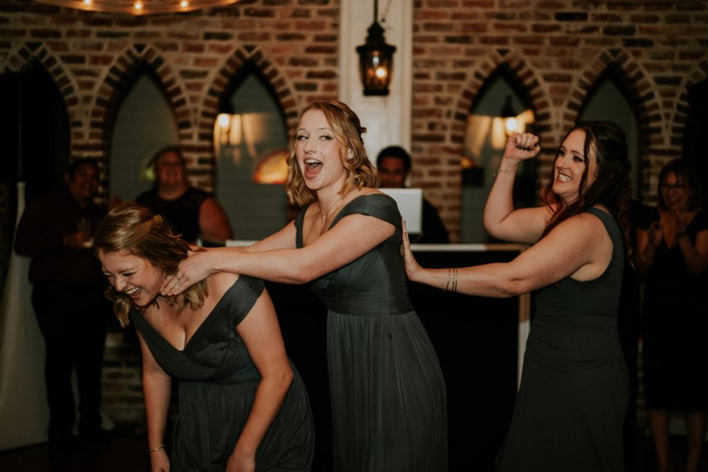 Bridesmaids act out scenes from horror movies during reception introductions
