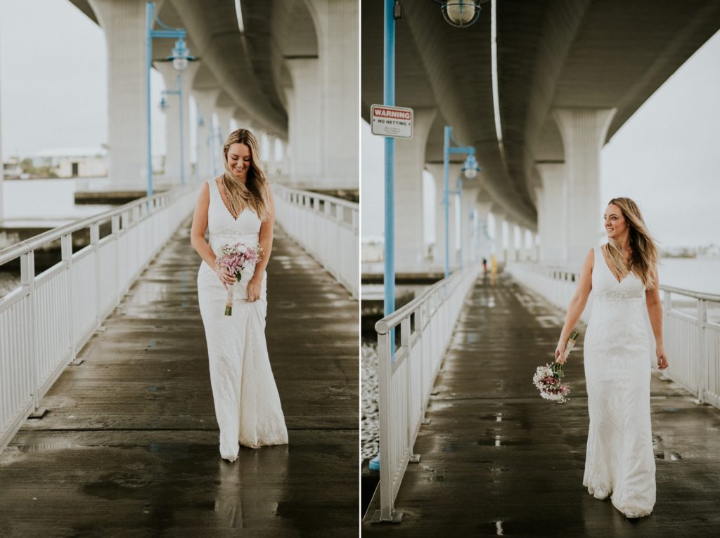 Bride walks under Roosevelt bridge Downtown Stuart FL wedding urban elopement