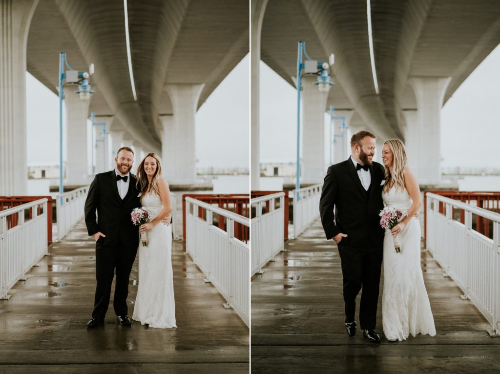 Bride and groom standing under Roosevelt bridge in Downtown Stuart FL elopement urban wedding