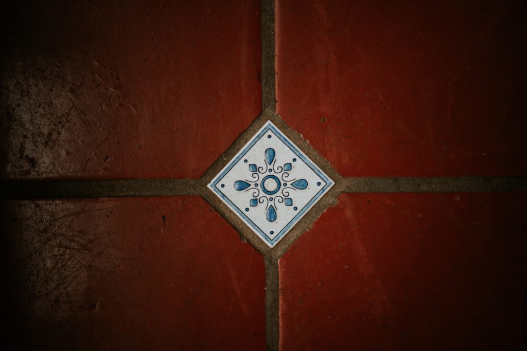 Cafe Martier red floor tile with white and blue decoration