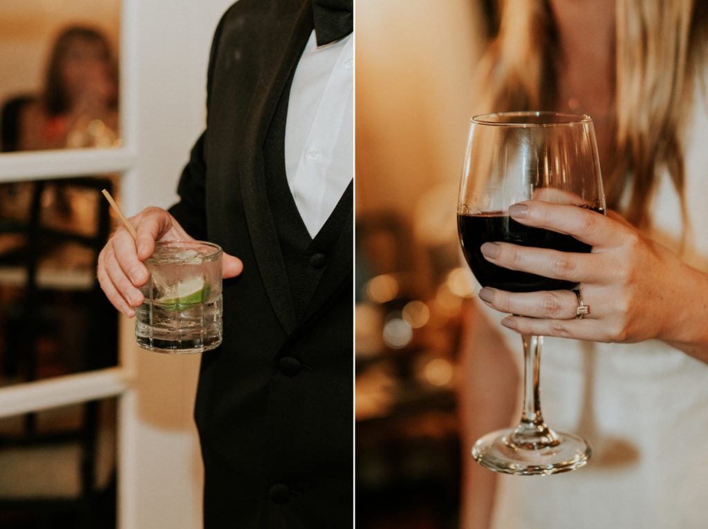 Close-up of couple holding cocktails at wedding reception