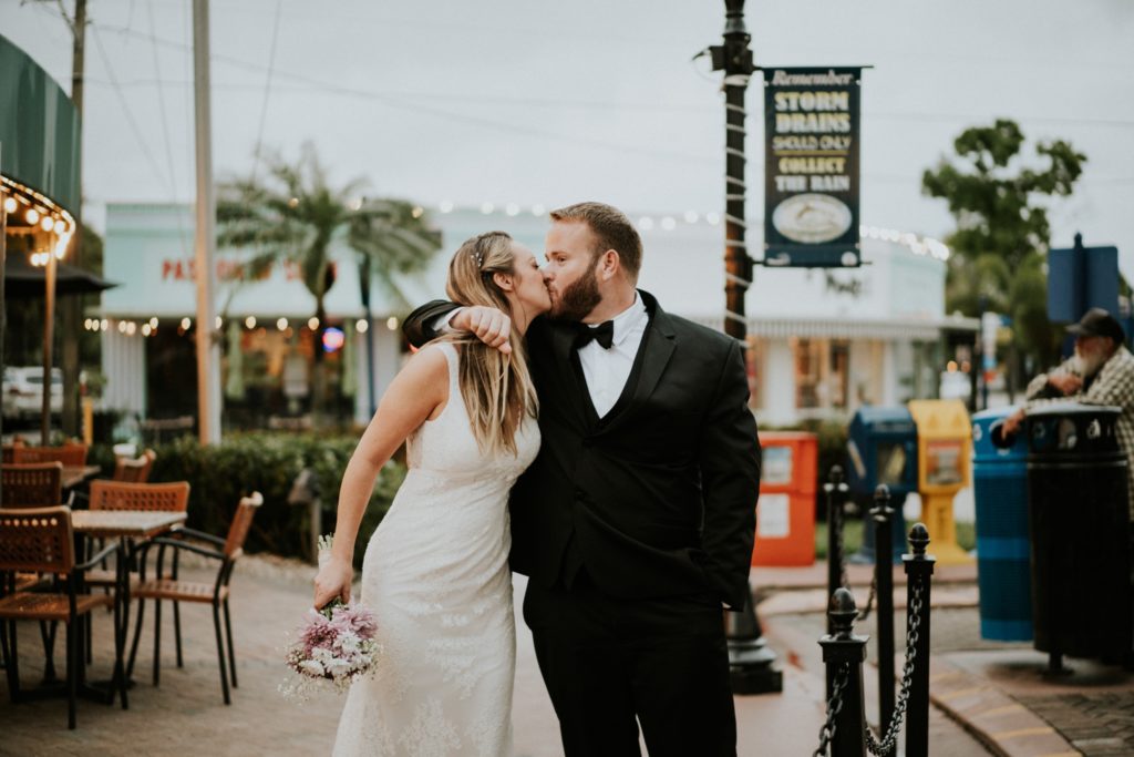 Bride and groom kiss in Downtown Stuart elopement