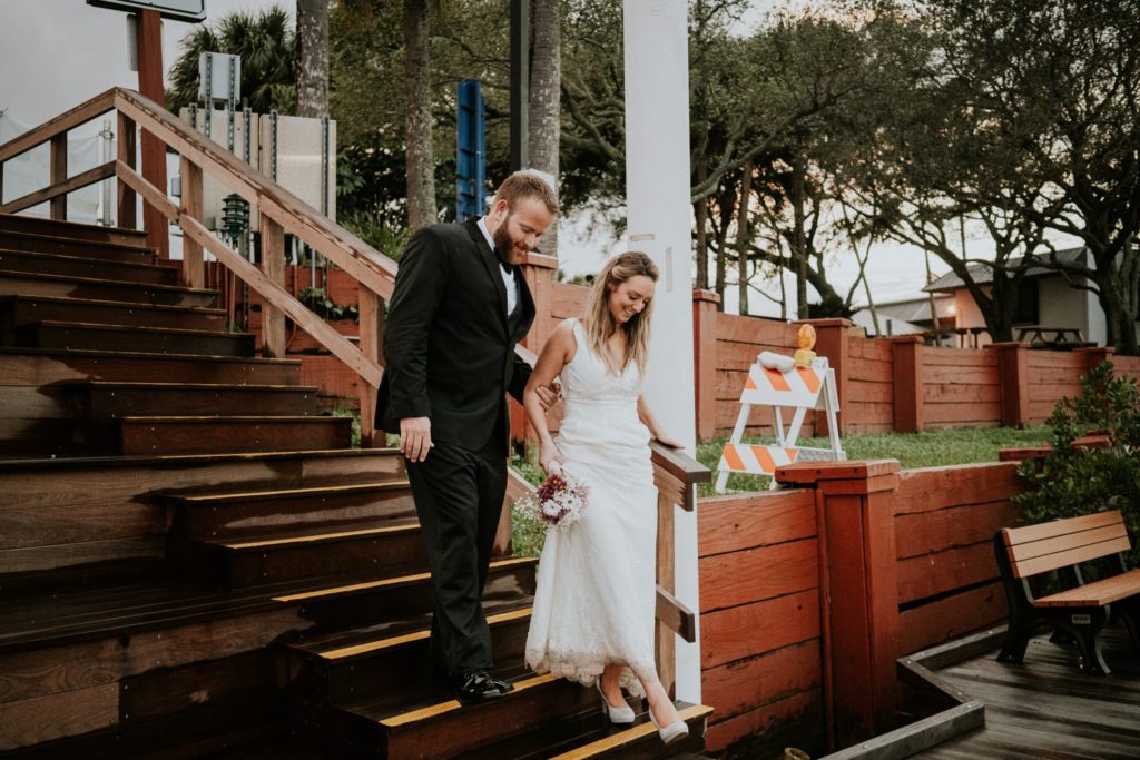 Bride and groom walk steps of Downtown Stuart Rockin' Riverwalk
