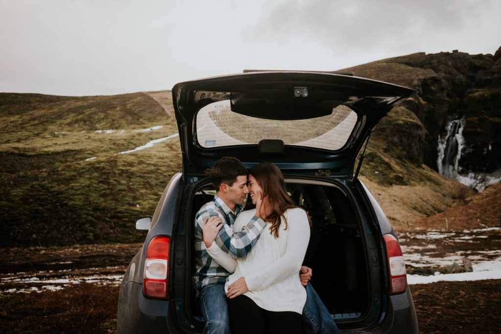 Iceland elopement couple hold each other in the back of a van on road trip