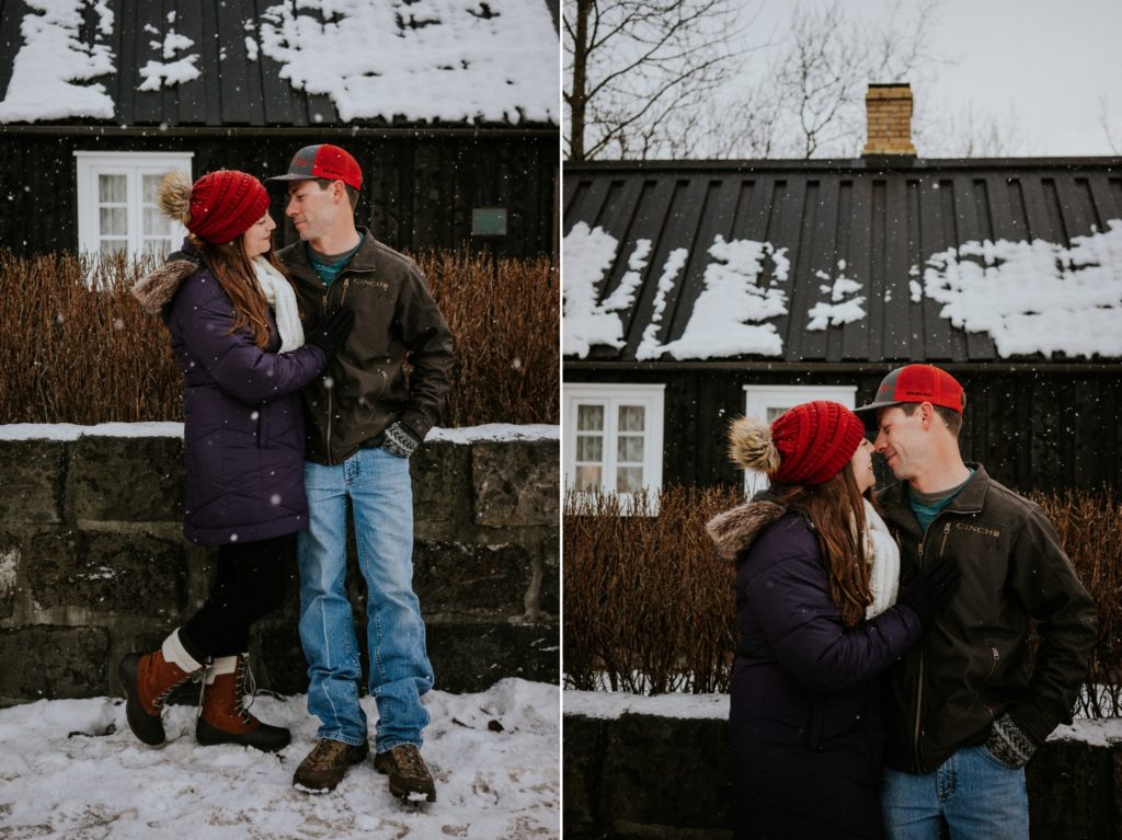 Reykjavík Iceland elopement couple stands in front of black house in the snow