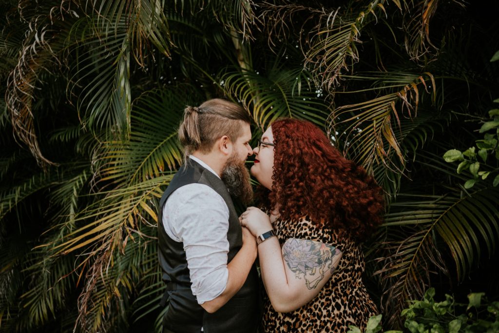 Matt & Nikki eskimo kiss in backyard engagement West Palm Beach Worth Avenue FL