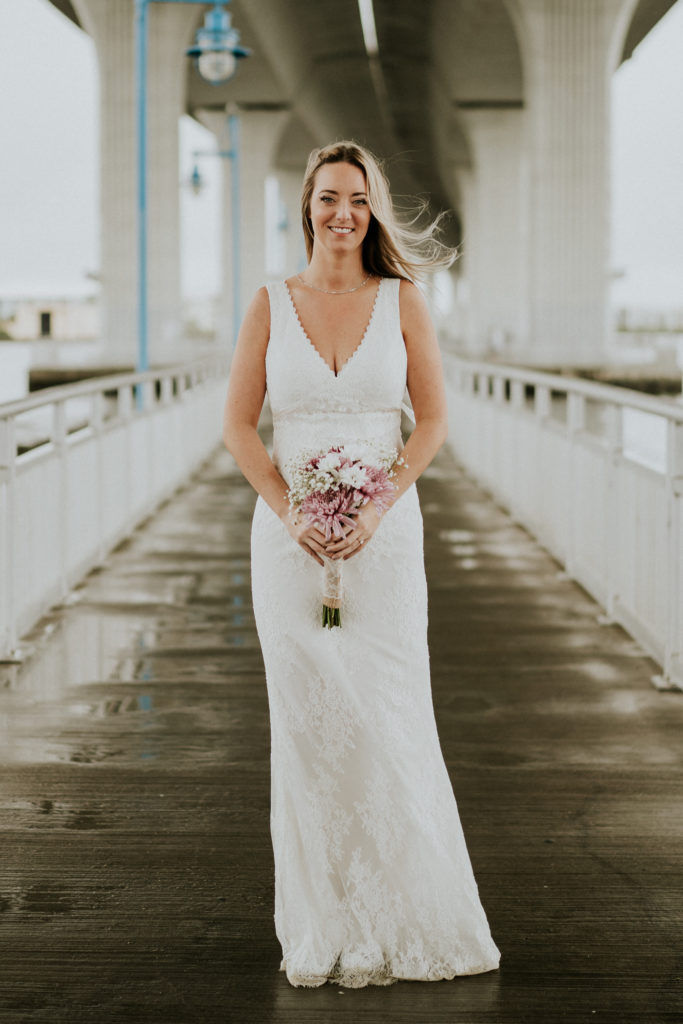 Scalloped V-neck lace wedding dress for Florida bride with open back & bow Downtown Stuart FL