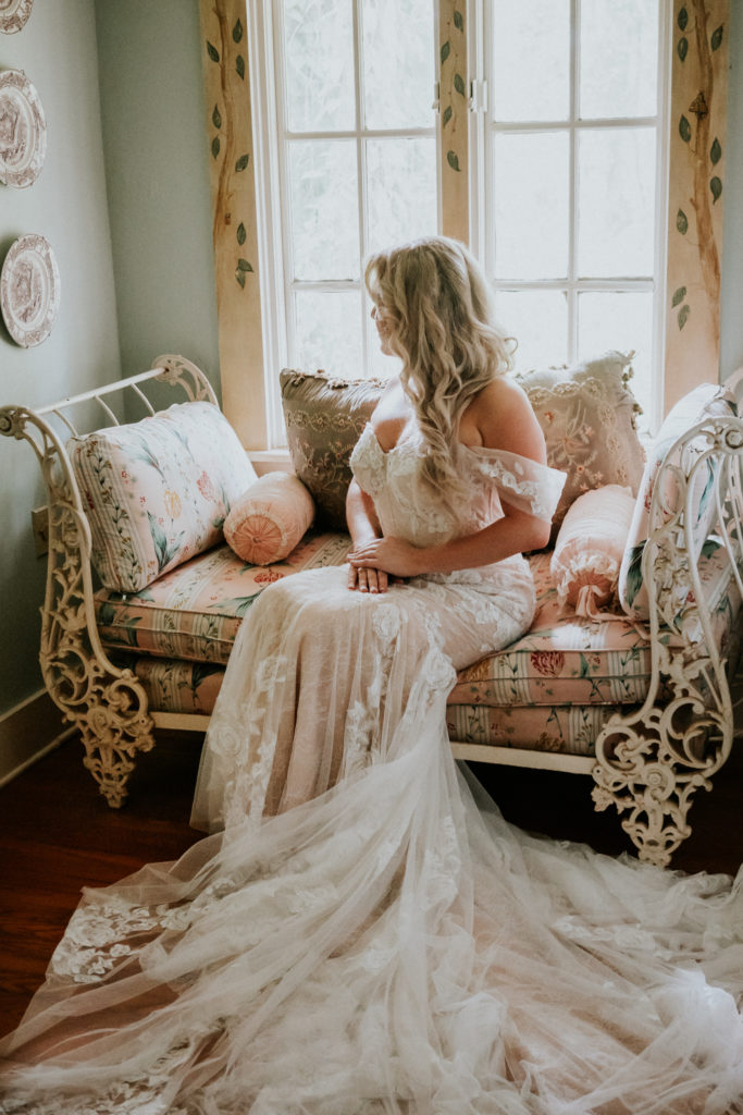 Rose lace appliqué pink off-the-shoulder wedding dress for Florida bride with chiffon train by Watters Historic Walton House Miami