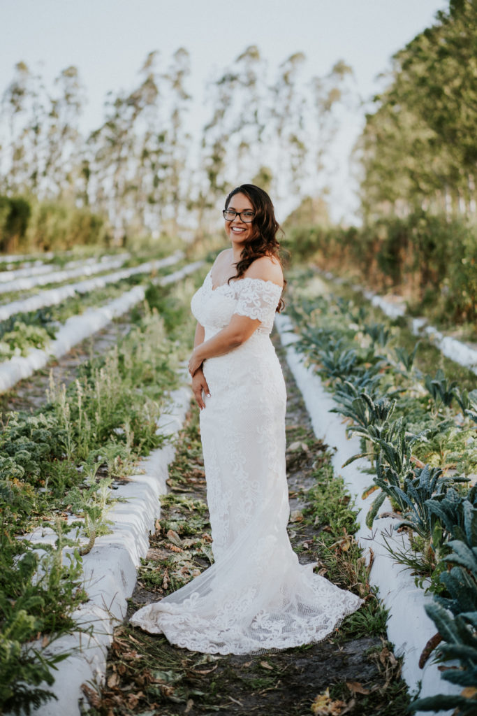 Fishnet lace appliqué off-the-shoulder wedding dress for Florida bride with sweep train Kai Kai Farm Indiantown FL