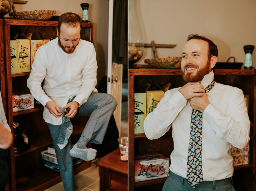 Groom puts on socks and tie in Duluth GA family home wedding