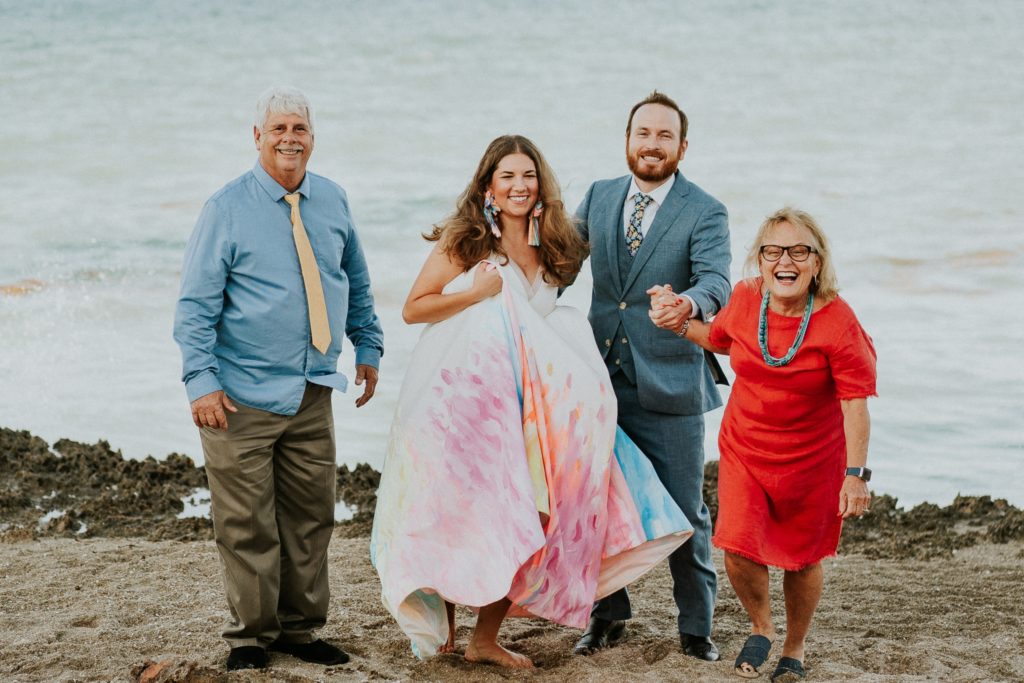 Family laughing wedding photo House of Refuge beach FL elopement photography