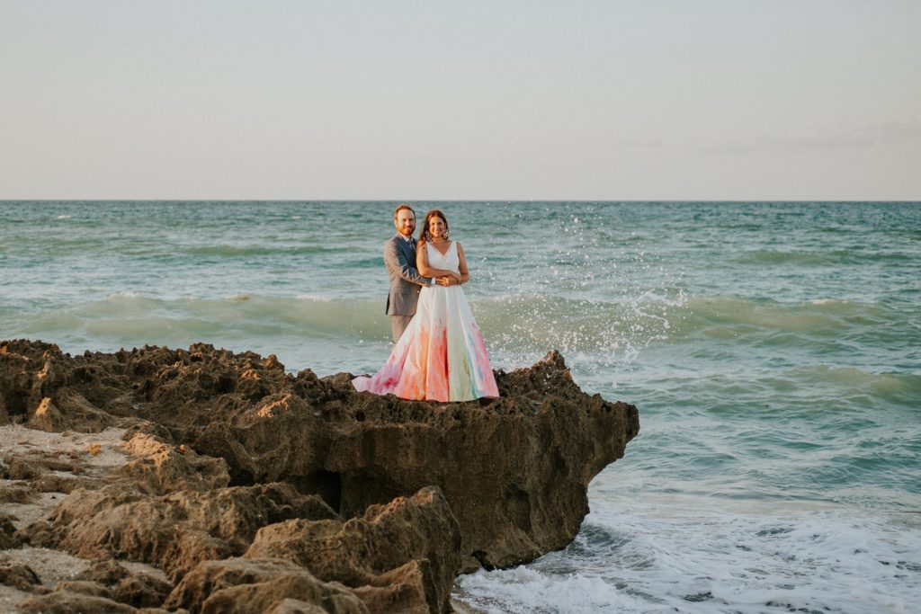 Bride and groom on rocky beach House of Refuge Stuart FL elopement