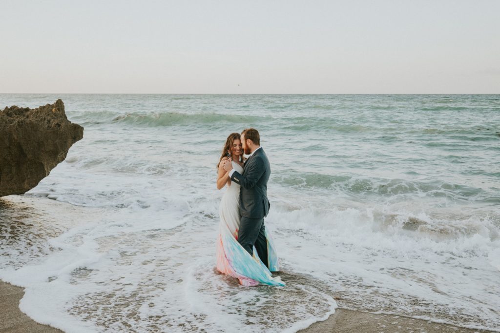 First dance in ocean waves House of Refuge beach wedding Stuart FL elopement photography