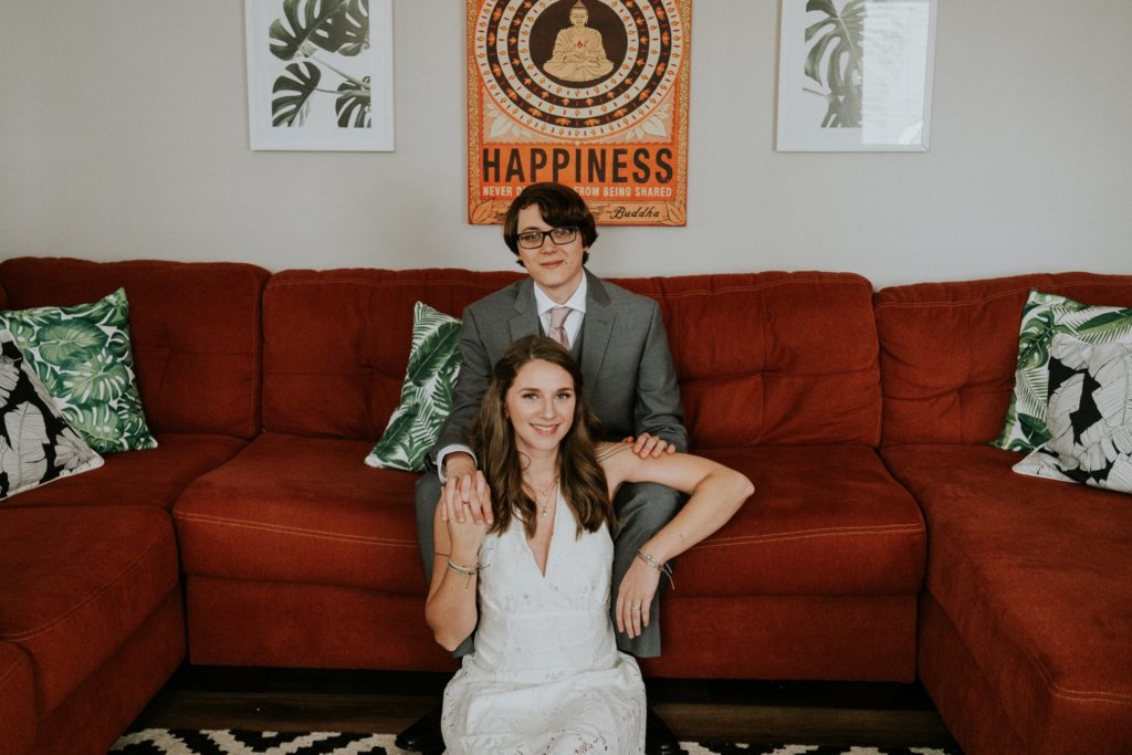Jupiter Florida wedding couple sit on sofa at home