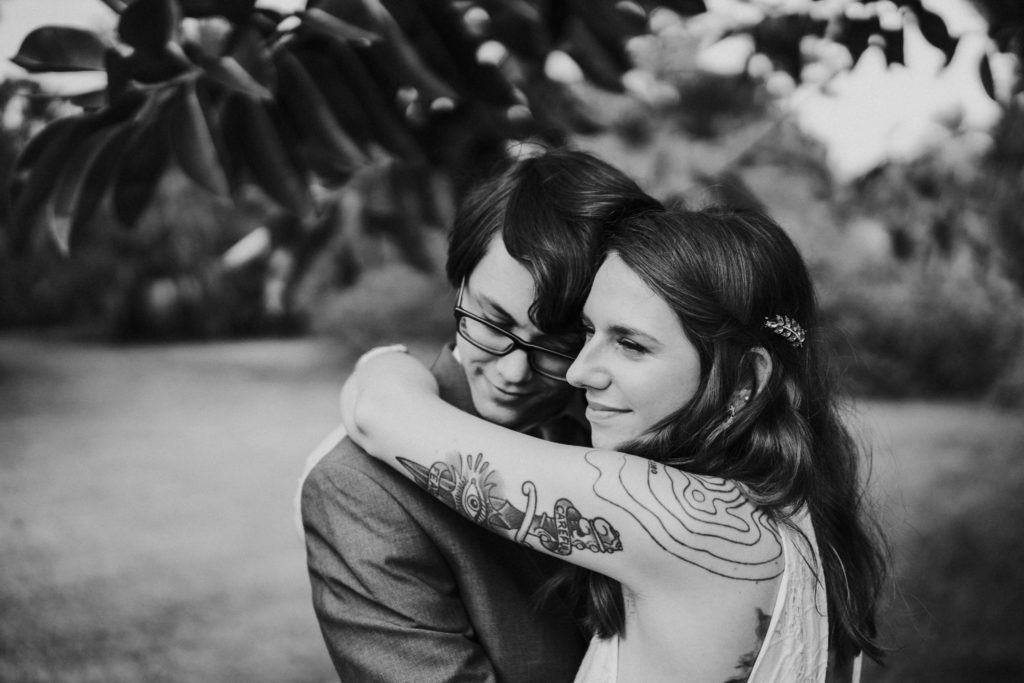 Jupiter Florida backyard wedding elopement tattooed bride hugs groom