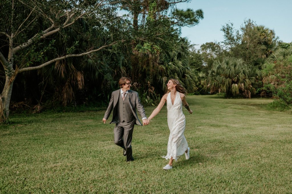 Bri and Aaron run through Jupiter Florida backyard wedding elopement