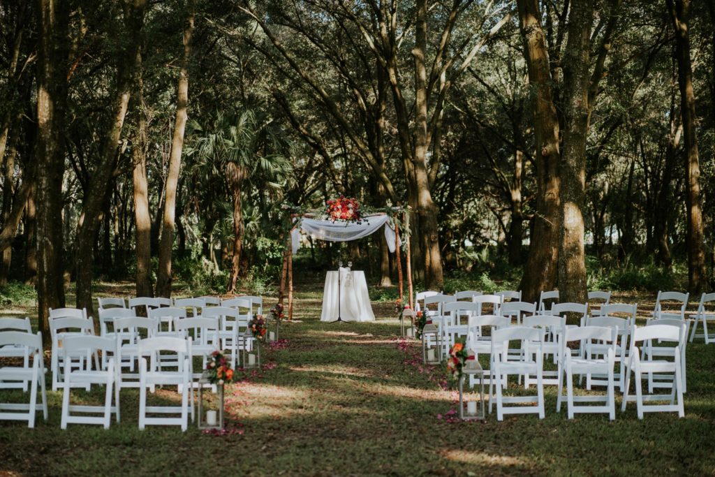 Casa Lantana wedding ceremony with wooden chuppah Stuart FL wedding photographer