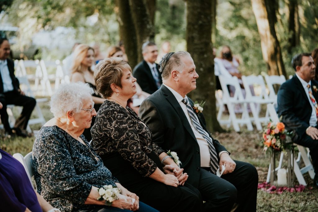 Parents watch wedding ceremony