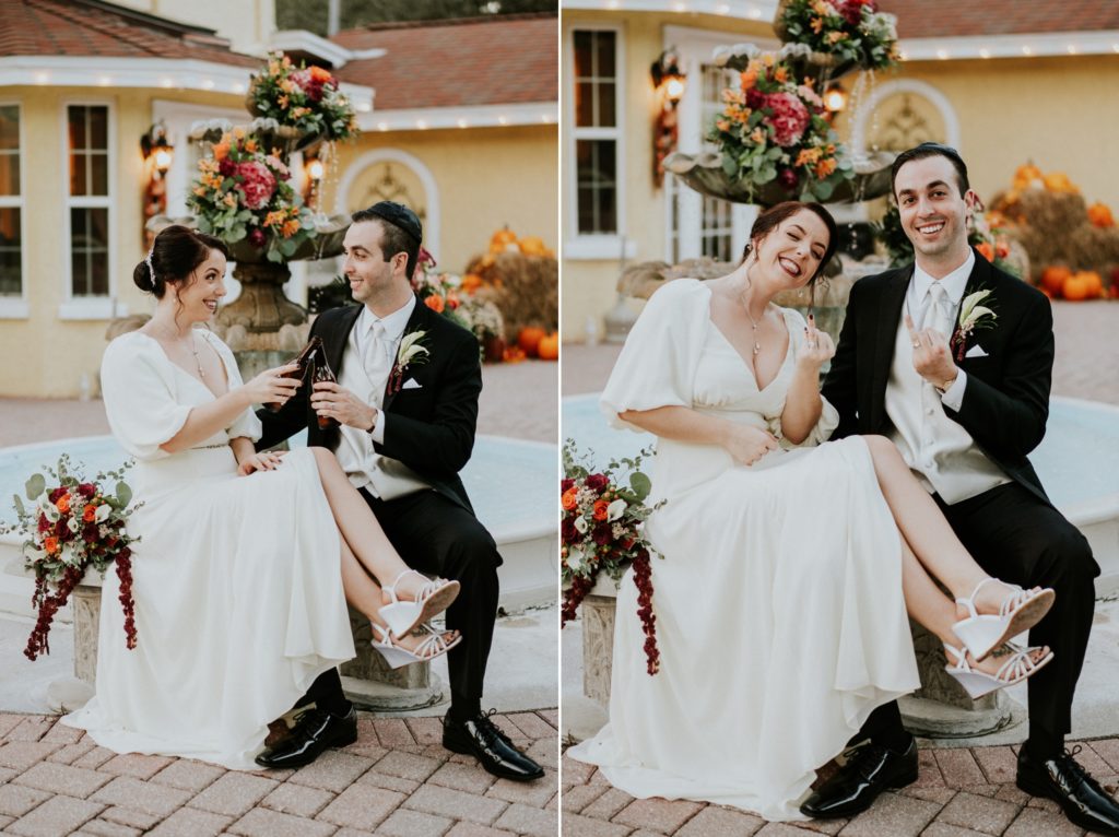 Casa Lantana wedding couple sit on floral fountain and toast beer bottles Stuart FL wedding photographer