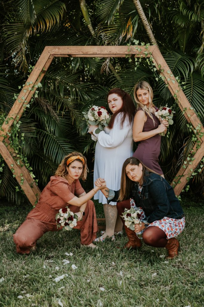 West Palm Beach FL backyard wedding bridal party Charlie's Angels pose under hexagon geometric arch