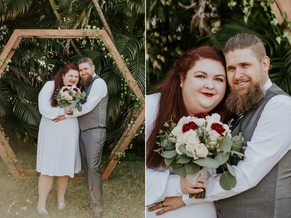 Redhead bride hugs groom under geometric hexagon arch in West Palm Beach FL backyard wedding