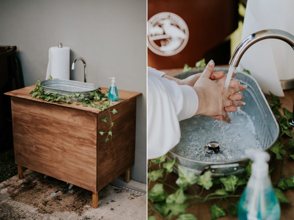 Portable wood hand washing station with metal sink basin for Florida backyard wedding