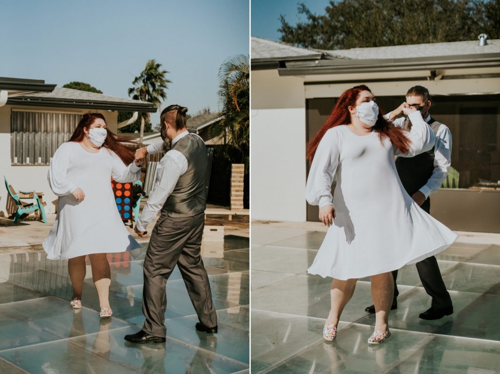 Groom spins bride first dance backyard wedding reception on pool dance floor