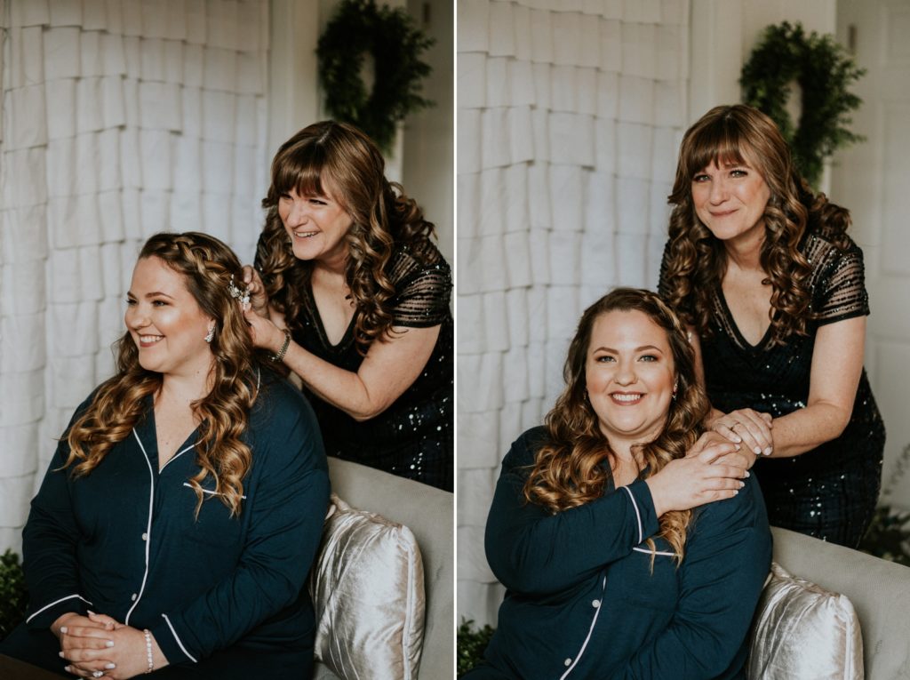 Mom fixes bride's hair in bridal suite