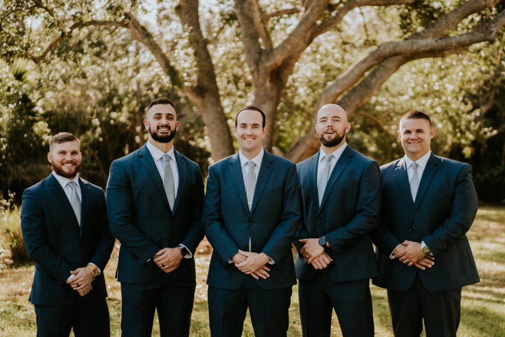 Groomsmen wearing blue Jos. A. Bank suits at Cattleya Chapel Vero Beach FL wedding