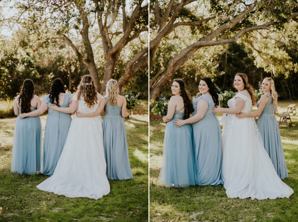 Bridesmaids dresses in dusty blue Azazie dresses look over shoulder